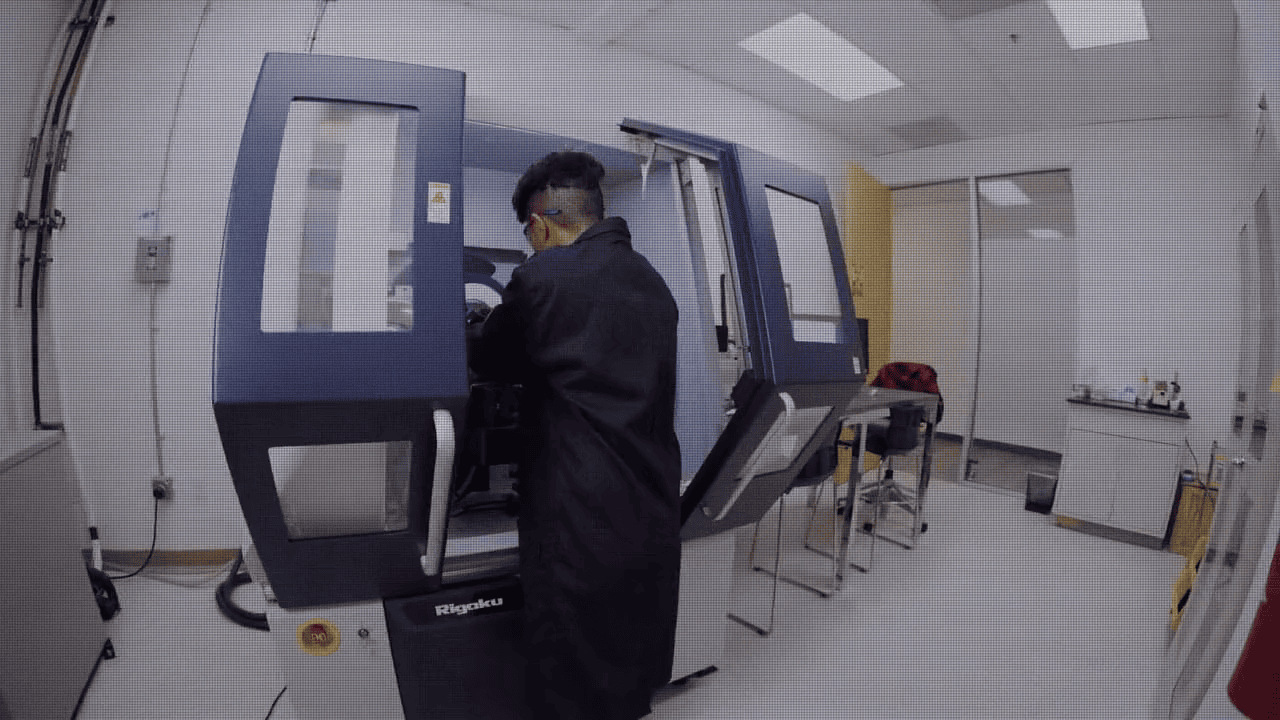 Technician operating advanced laboratory equipment at Covalent.